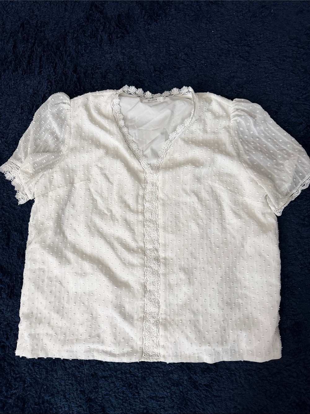 White lacy v-neck blouse. Size L. Gently worn. No damage.
